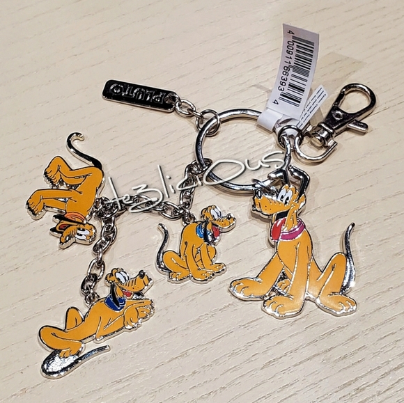 Disney Accessories - DISNEY PARKS RETRO PLUTO KEYCHAIN